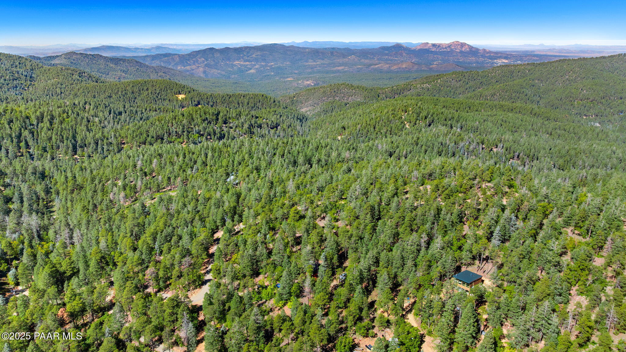 318 East Poland Road Prescott, AZ 86303 - Photo 26 of 28 a view of a lush green hillside and a houses