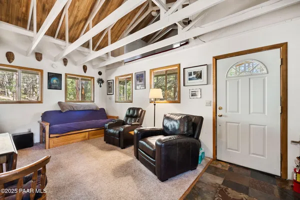 a living room with furniture and windows