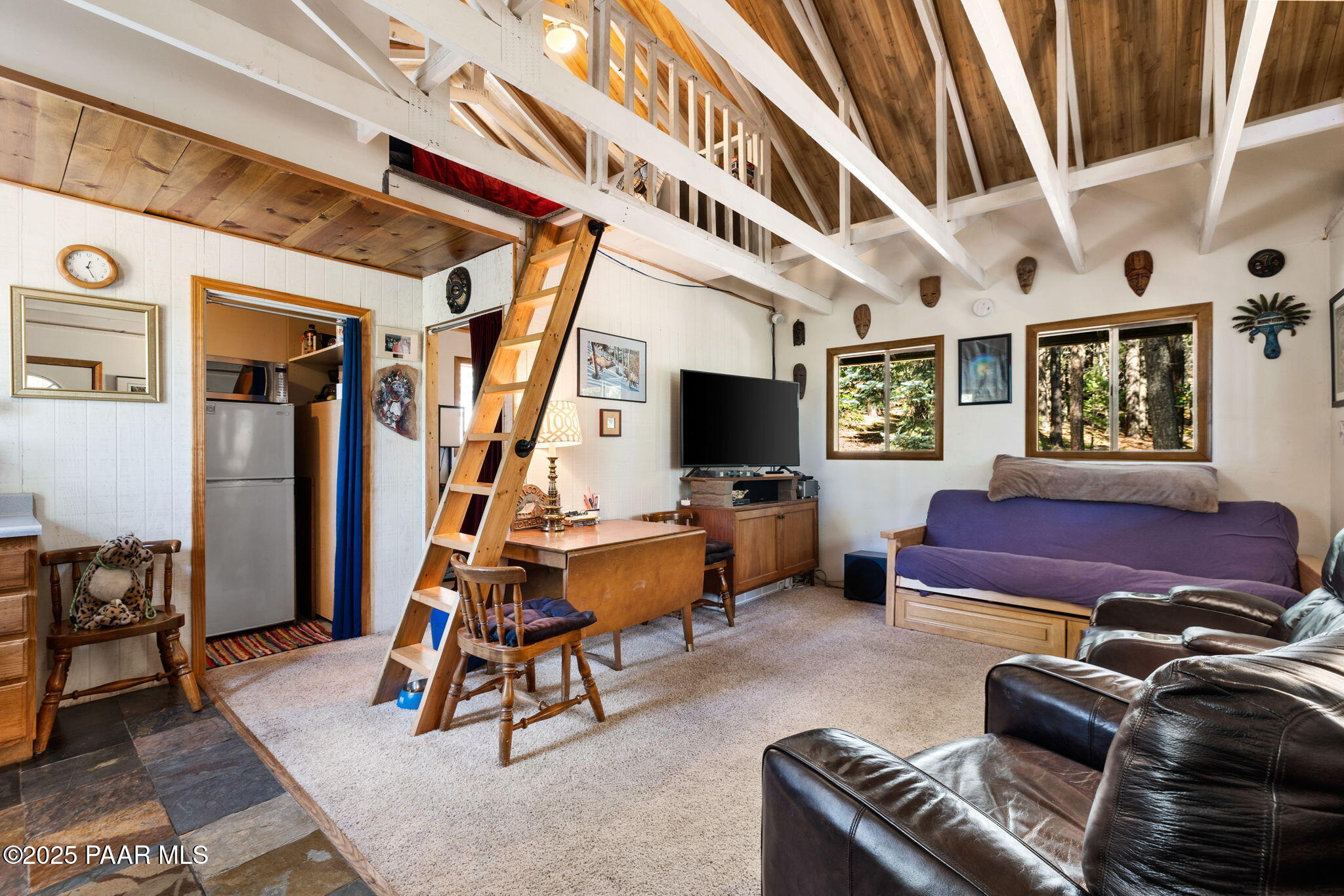 318 East Poland Road Prescott, AZ 86303 - Photo 7 of 28 a living room with furniture gym equipment and a flat screen tv