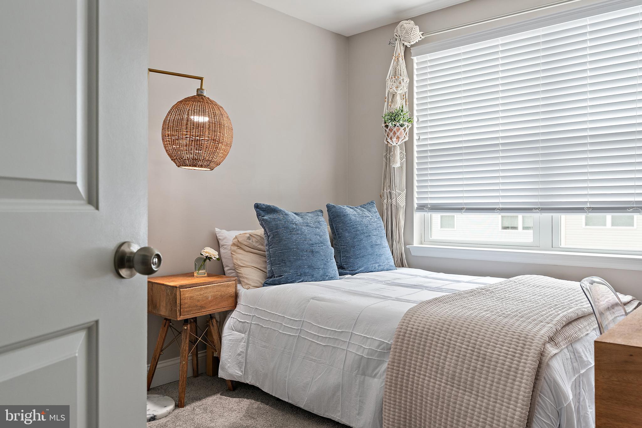 1614 Belle Drive Annapolis, MD 21401 - Photo 18 of 36 a bedroom with a bed and a chandelier