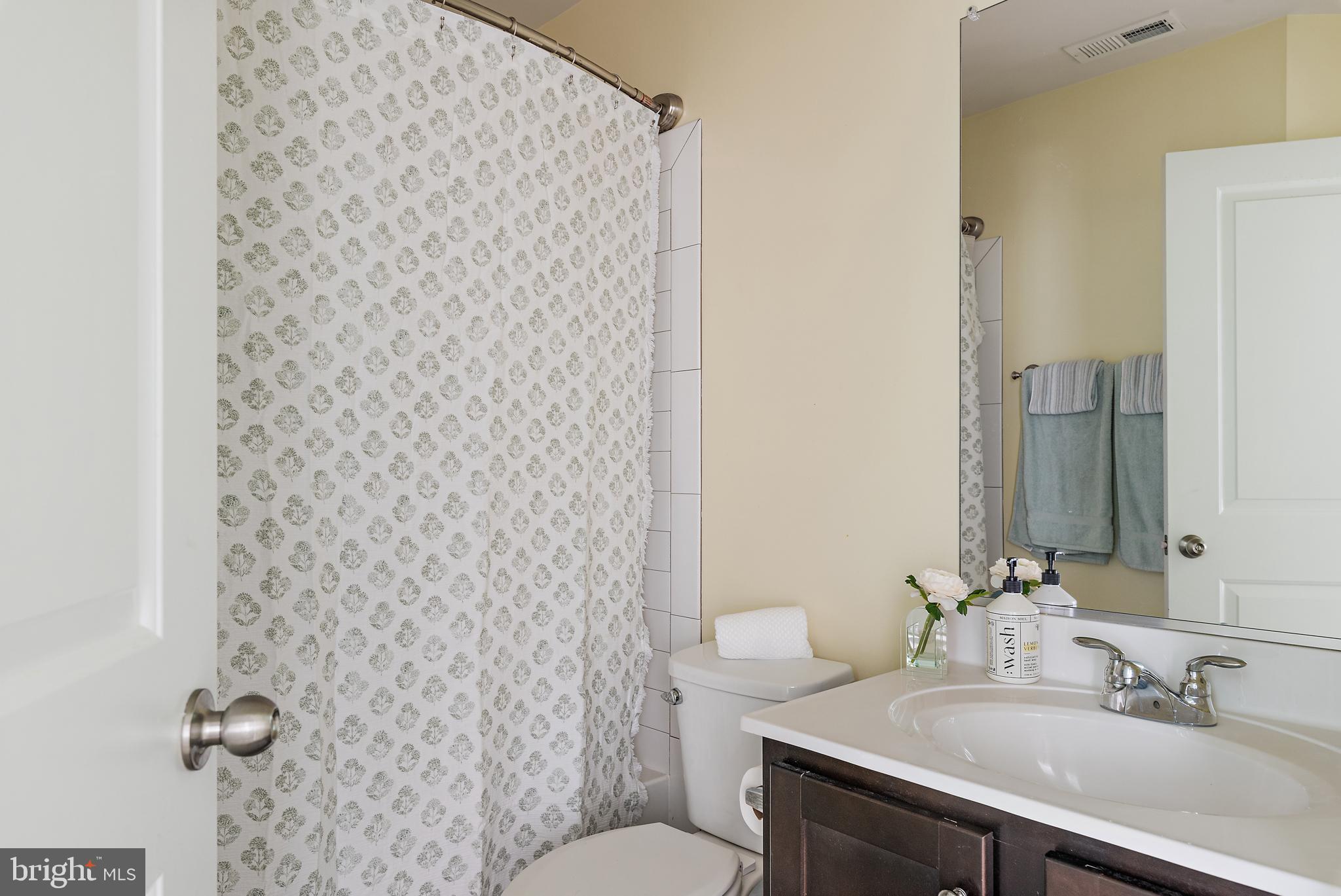 1614 Belle Drive Annapolis, MD 21401 - Photo 19 of 36 a bathroom with a sink and a mirror