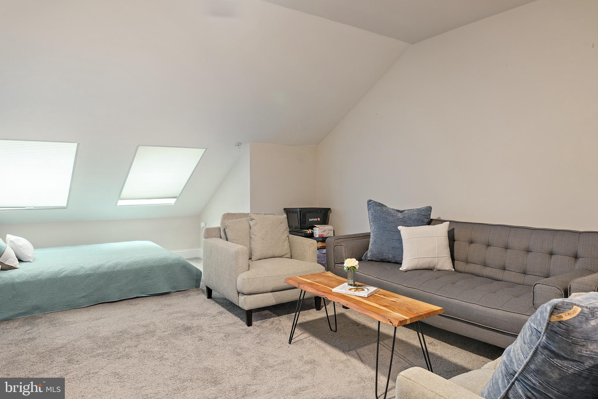 1614 Belle Drive Annapolis, MD 21401 - Photo 26 of 36 a living room with furniture and a couch