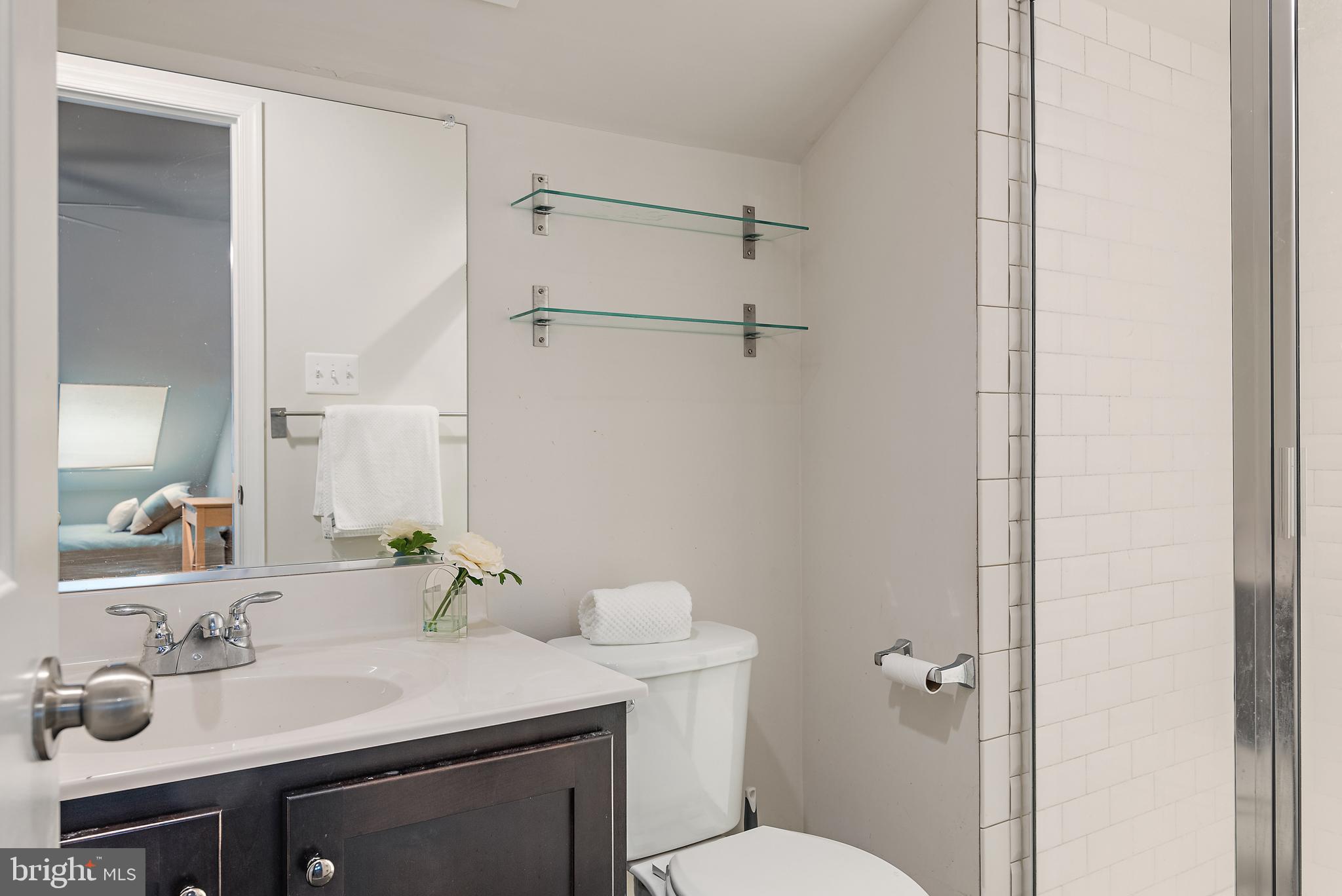 1614 Belle Drive Annapolis, MD 21401 - Photo 27 of 36 a bathroom with a sink vanity mirror and toilet
