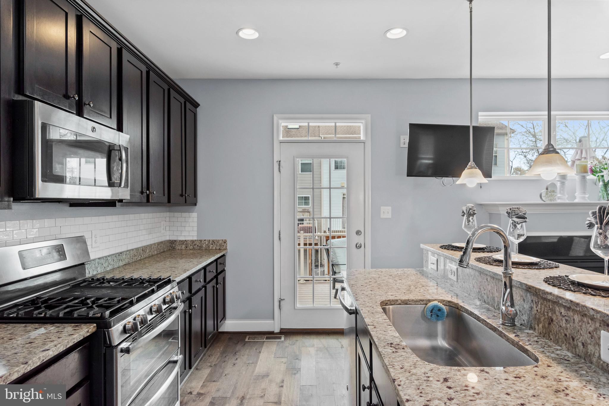 1614 Belle Drive Annapolis, MD 21401 - Photo 9 of 36 a kitchen that has a sink and a stove top oven