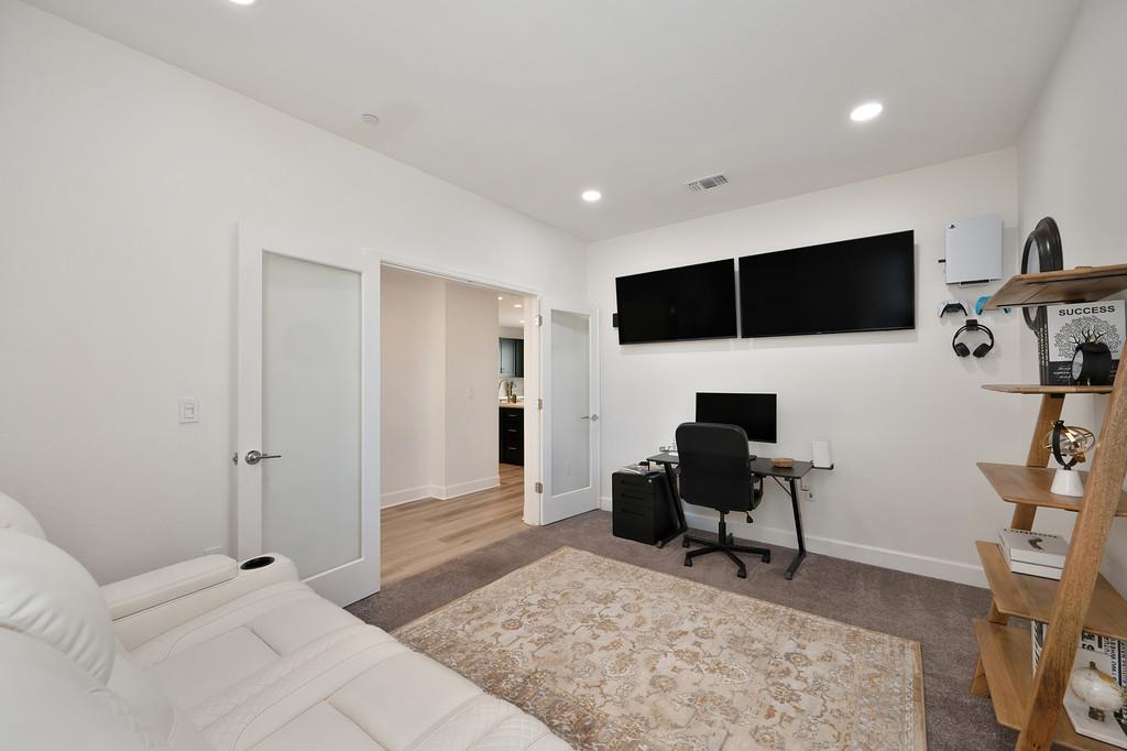 17500 Beachwood Road Lathrop, CA 95330 - Photo 18 of 78 a living room with furniture and a flat screen tv