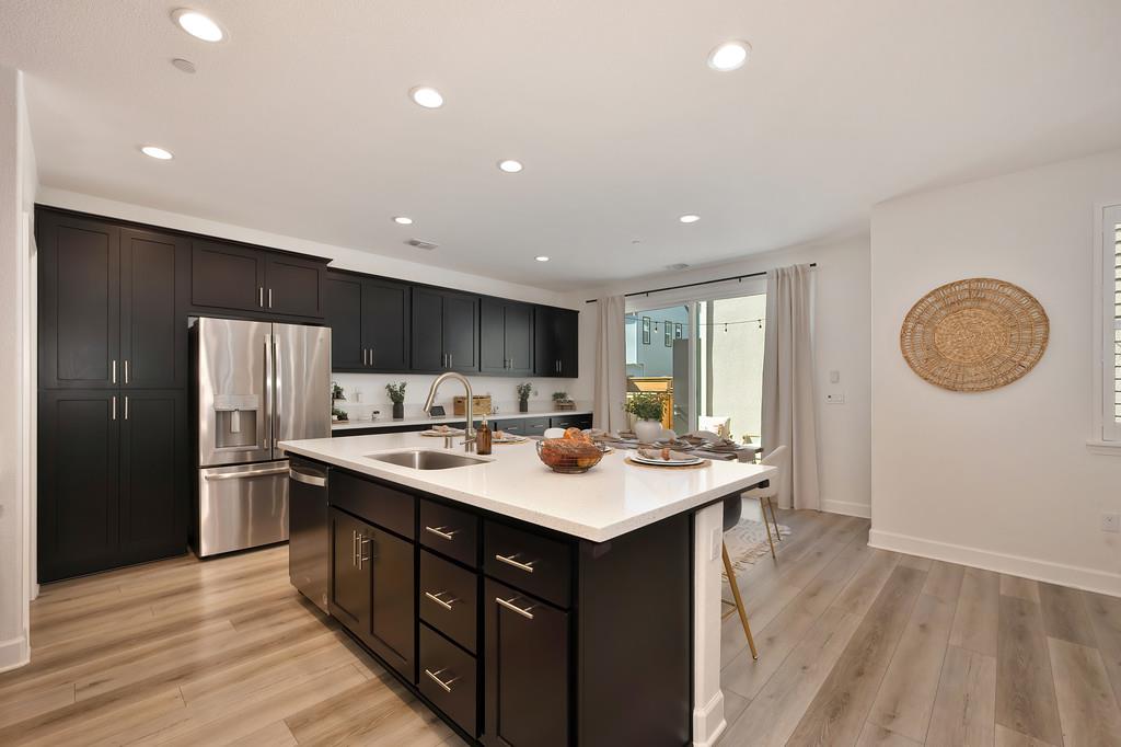 17500 Beachwood Road Lathrop, CA 95330 - Photo 20 of 78 a kitchen with a sink and cabinets