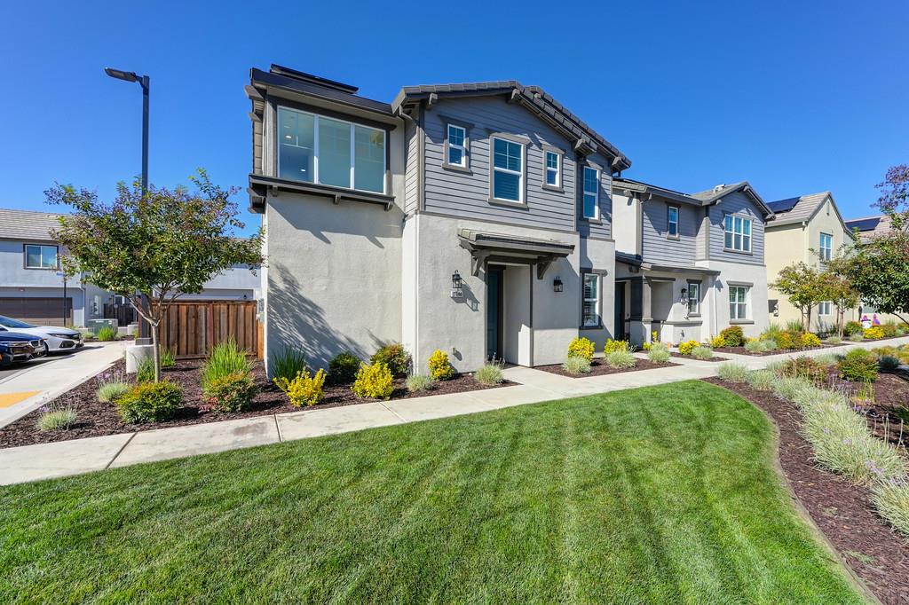 17500 Beachwood Road Lathrop, CA 95330 - Photo 3 of 78 a view of a house with swimming pool and a yard