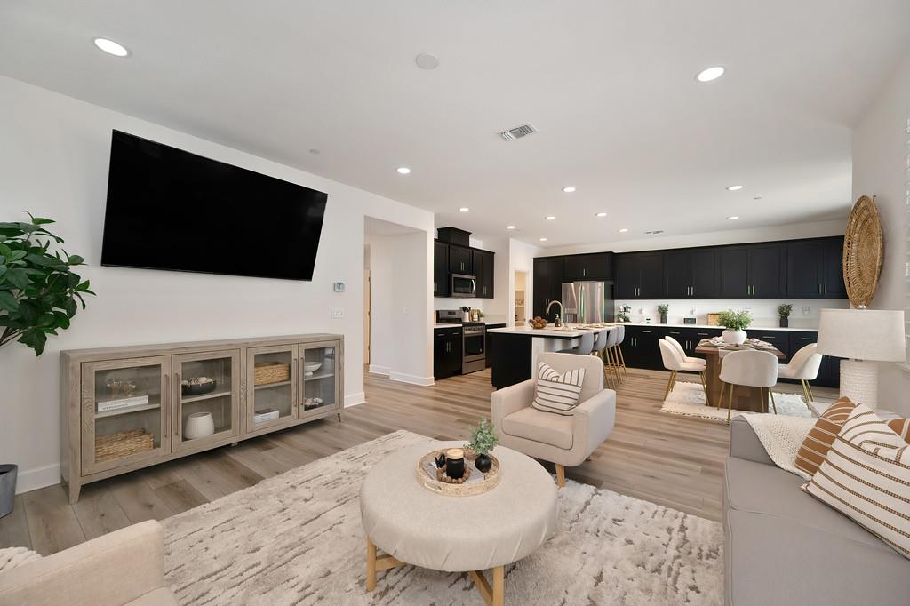 17500 Beachwood Road Lathrop, CA 95330 - Photo 33 of 78 a living room with furniture and a flat screen tv