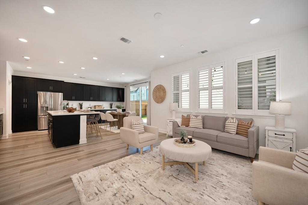 17500 Beachwood Road Lathrop, CA 95330 - Photo 34 of 78 a living room with furniture kitchen and a large window