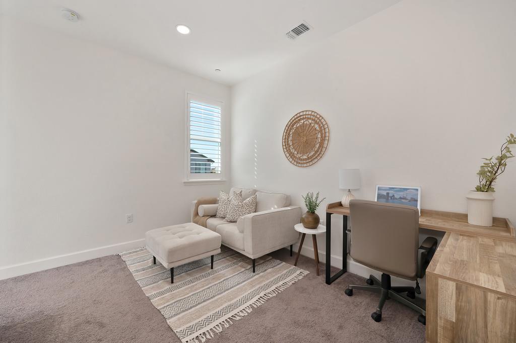 17500 Beachwood Road Lathrop, CA 95330 - Photo 37 of 78 a living room with a couch and a window