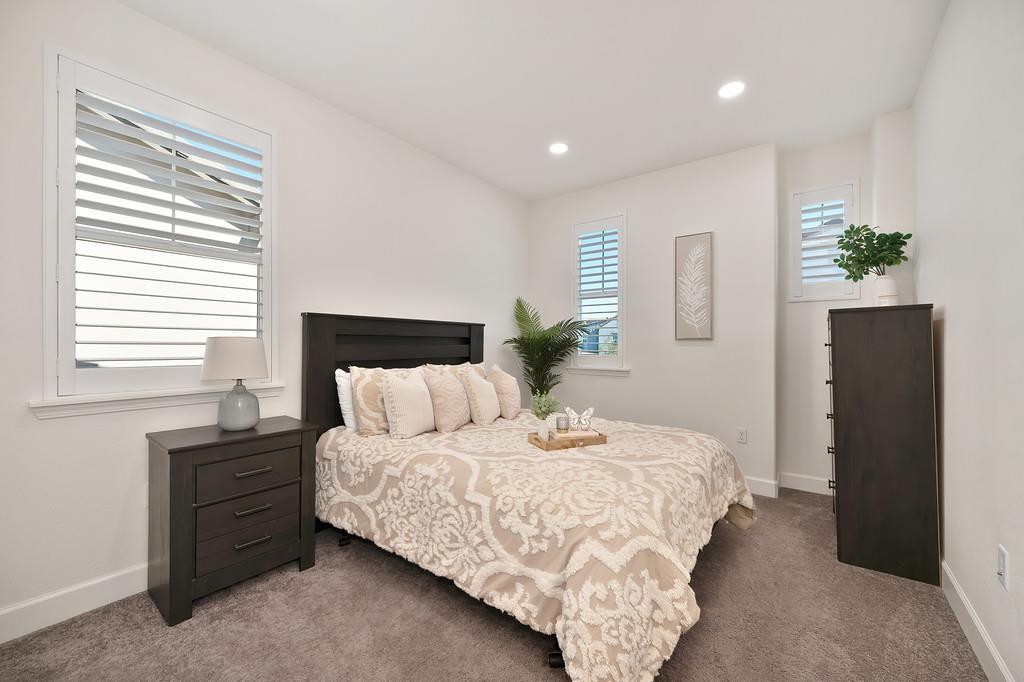 17500 Beachwood Road Lathrop, CA 95330 - Photo 49 of 78 a bedroom with a bed and a dresser