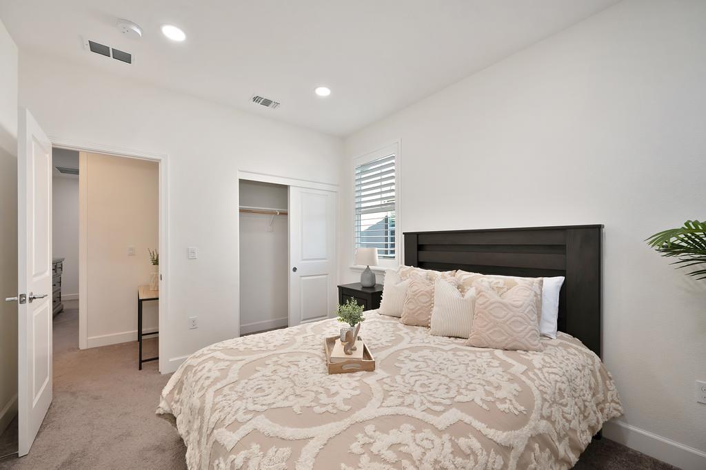 17500 Beachwood Road Lathrop, CA 95330 - Photo 50 of 78 a bedroom with a bed and a night stand