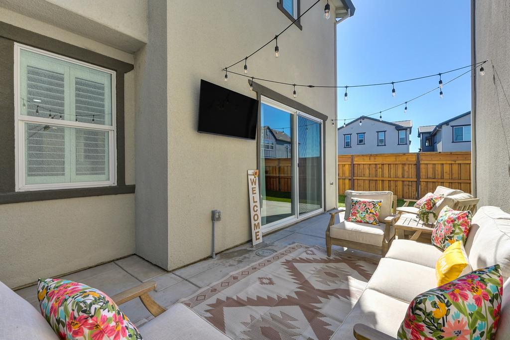 17500 Beachwood Road Lathrop, CA 95330 - Photo 54 of 78 a living room with furniture and a flat screen tv