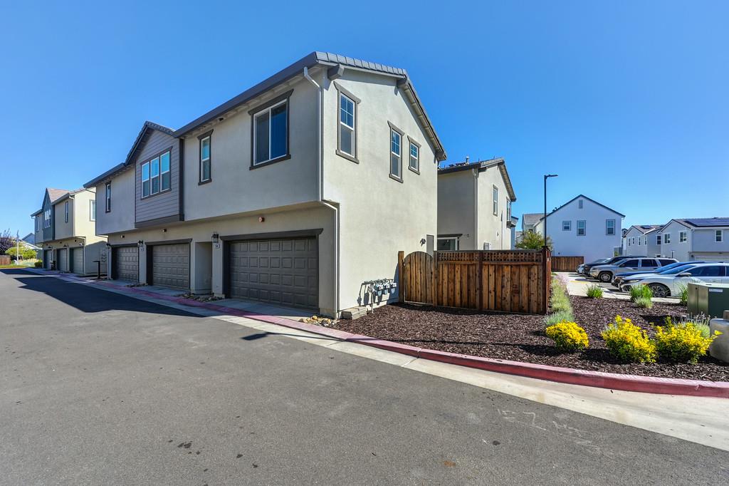 17500 Beachwood Road Lathrop, CA 95330 - Photo 68 of 78 a front view of a house with a yard and garage