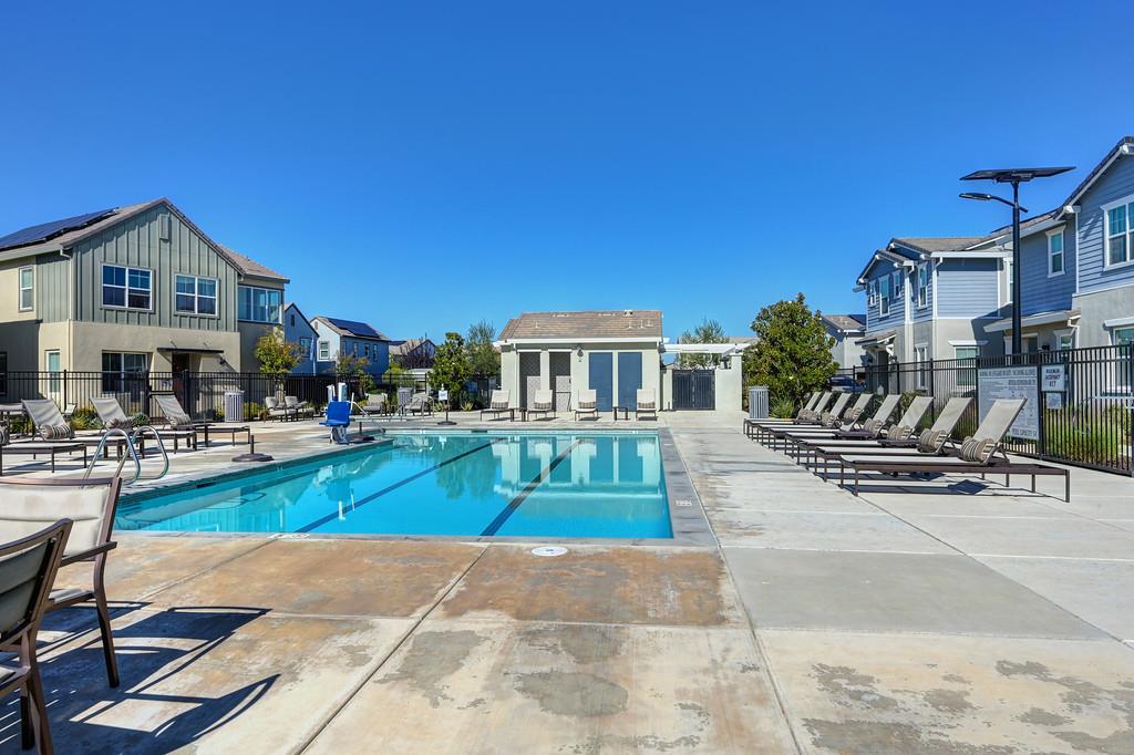 17500 Beachwood Road Lathrop, CA 95330 - Photo 71 of 78 a front view of a house with swimming pool having outdoor seating