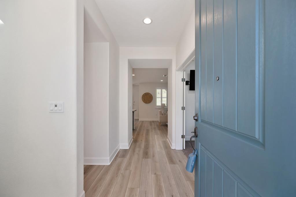 17500 Beachwood Road Lathrop, CA 95330 - Photo 10 of 78 a view of a hallway with wooden floor