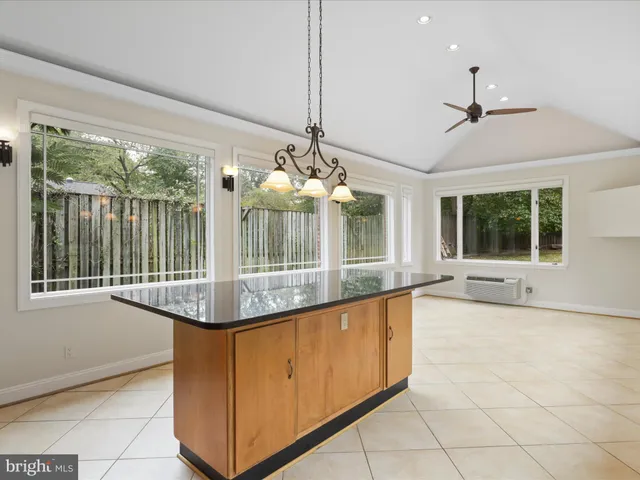a view of a house with chairs and wooden floor