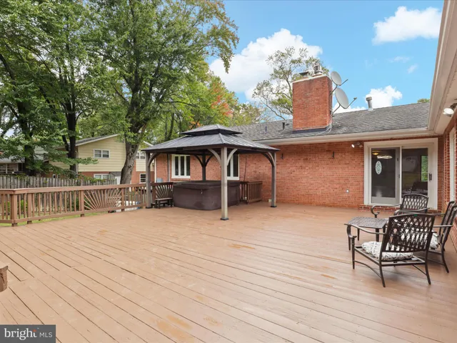a view of a chairs and table in the roof deck