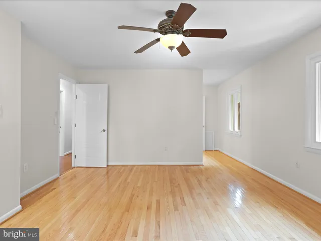 a spacious bathroom with a granite countertop sink toilet and shower