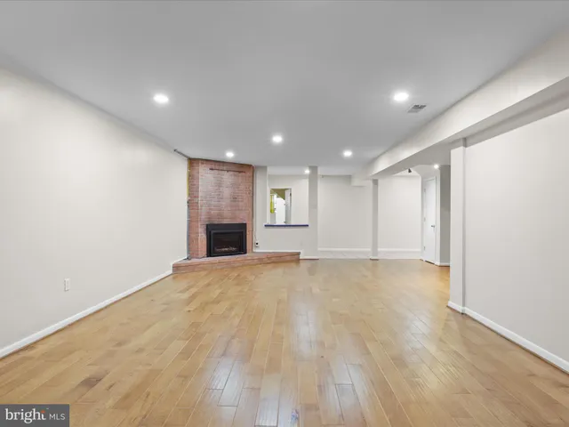 a picture of a room with a refrigerator