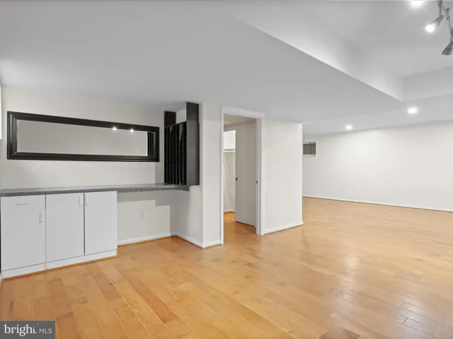 a utility room with cabinets dryer and washer