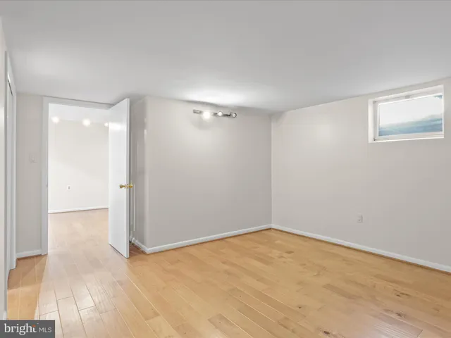 a bathroom with a shower sink vanity and mirror