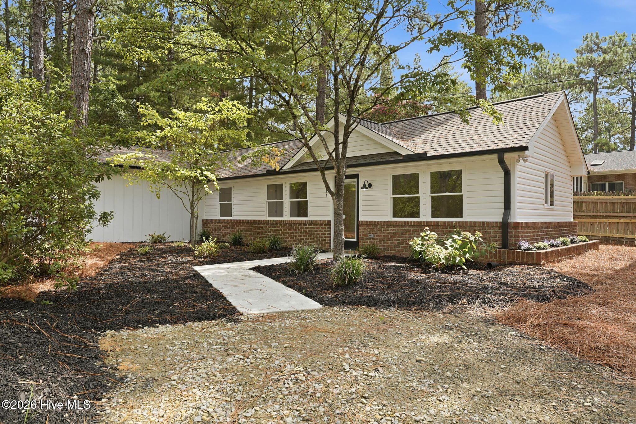 611 Sun Road Aberdeen, NC 28315 - Photo 32 of 59 Separate cottage/ADU with concrete walkway from parking spot