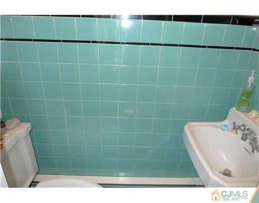 1707 River Road Belmar, NJ 07719 - Photo 12 of 17 a bathroom with a sink toilet and shower