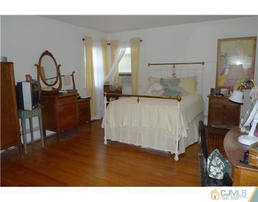1707 River Road Belmar, NJ 07719 - Photo 7 of 17 a living room with furniture and a fireplace