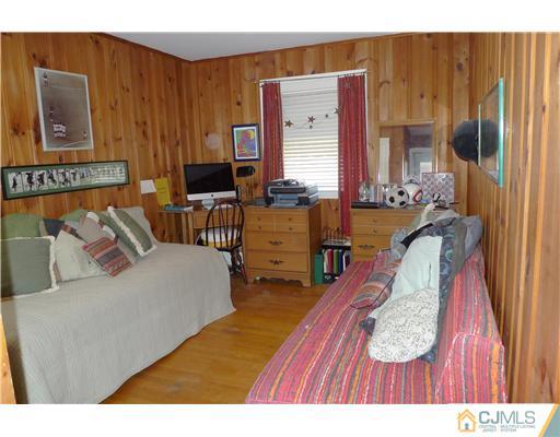 1707 River Road Belmar, NJ 07719 - Photo 9 of 17 a living room with furniture and a wooden floor