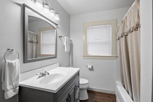 a bathroom with a sink vanity and a mirror