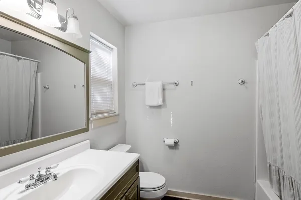 a bathroom with a sink and toilet