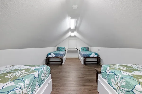 a bedroom with bed and a couch