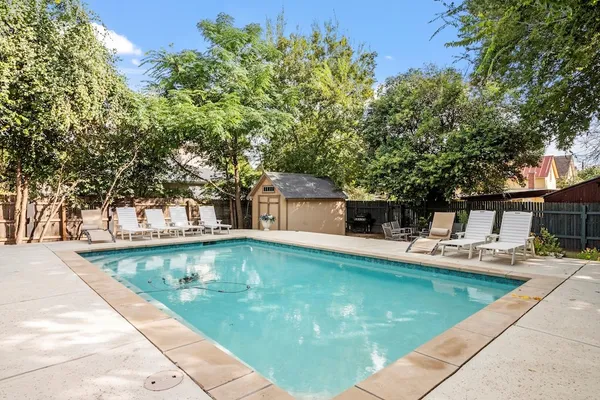 a view of a swimming pool with chairs