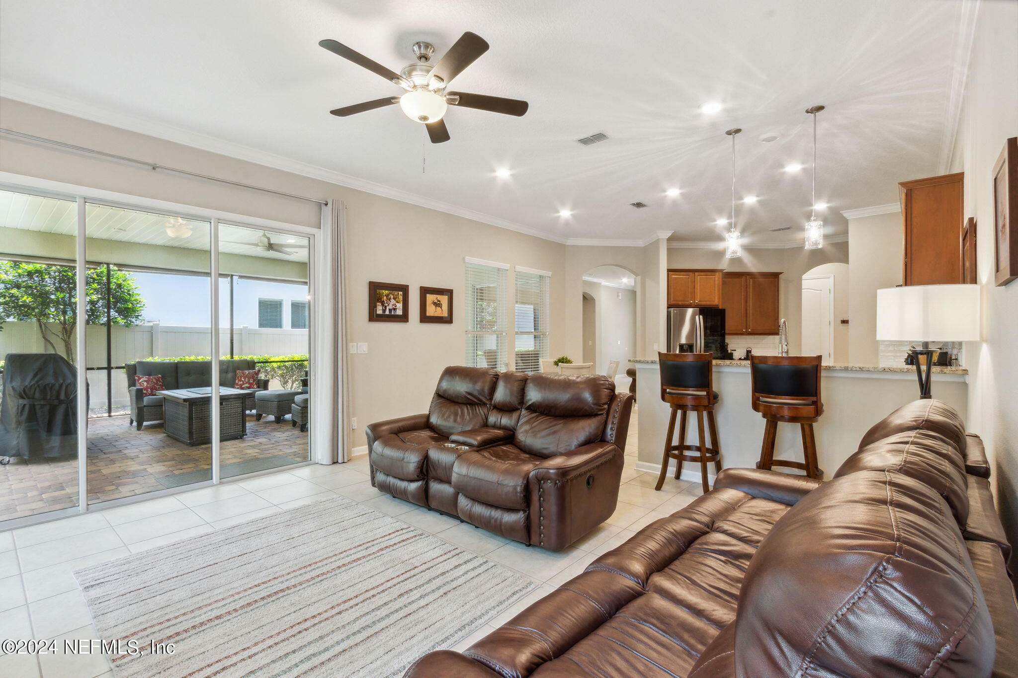 369 Medio Drive St. Augustine, FL 32095 - Photo 11 of 25 a living room with furniture and a large window