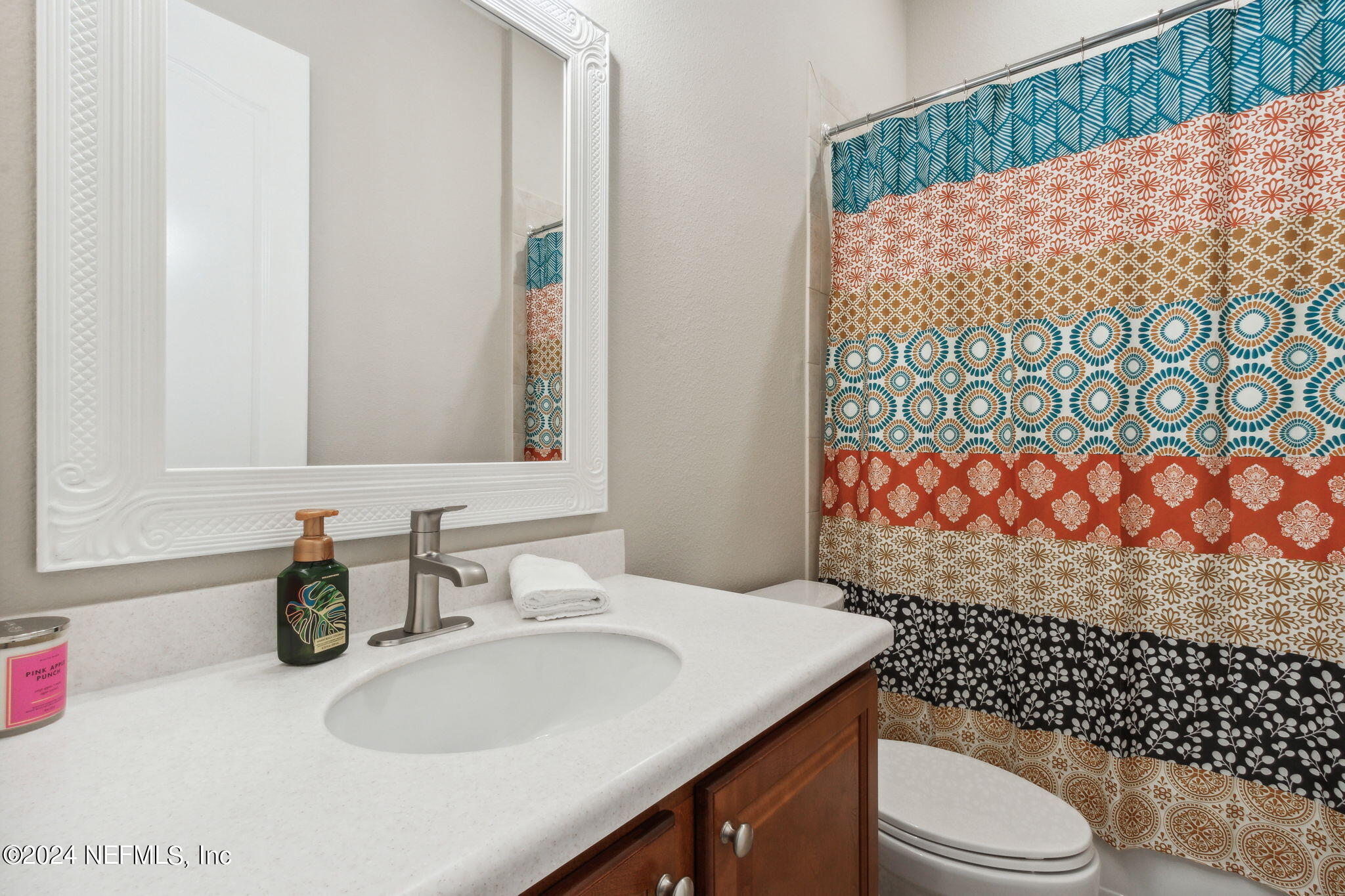 369 Medio Drive St. Augustine, FL 32095 - Photo 17 of 25 a bathroom with a sink toilet and shower