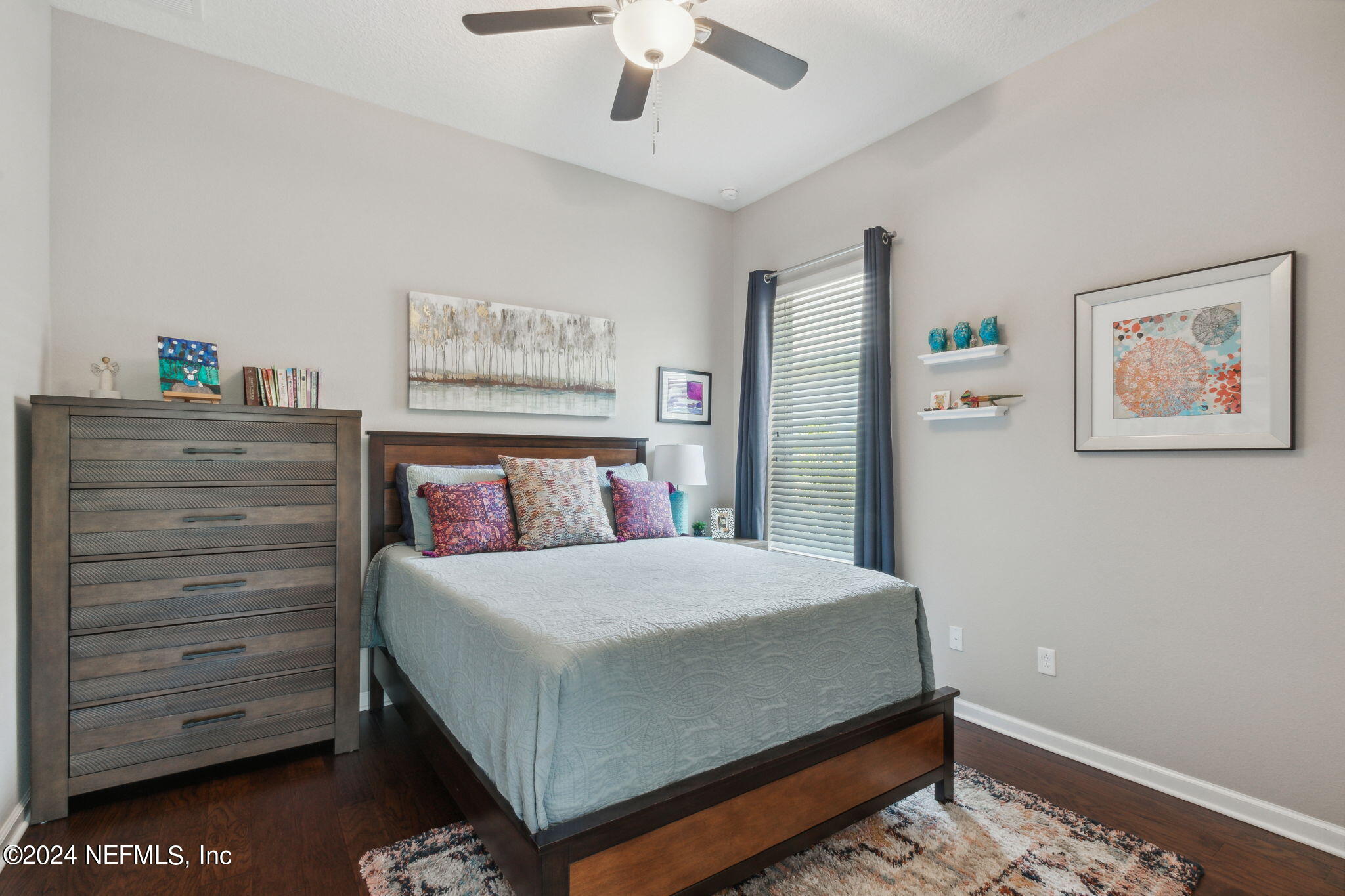 369 Medio Drive St. Augustine, FL 32095 - Photo 19 of 25 a bedroom with a bed and a cabinet