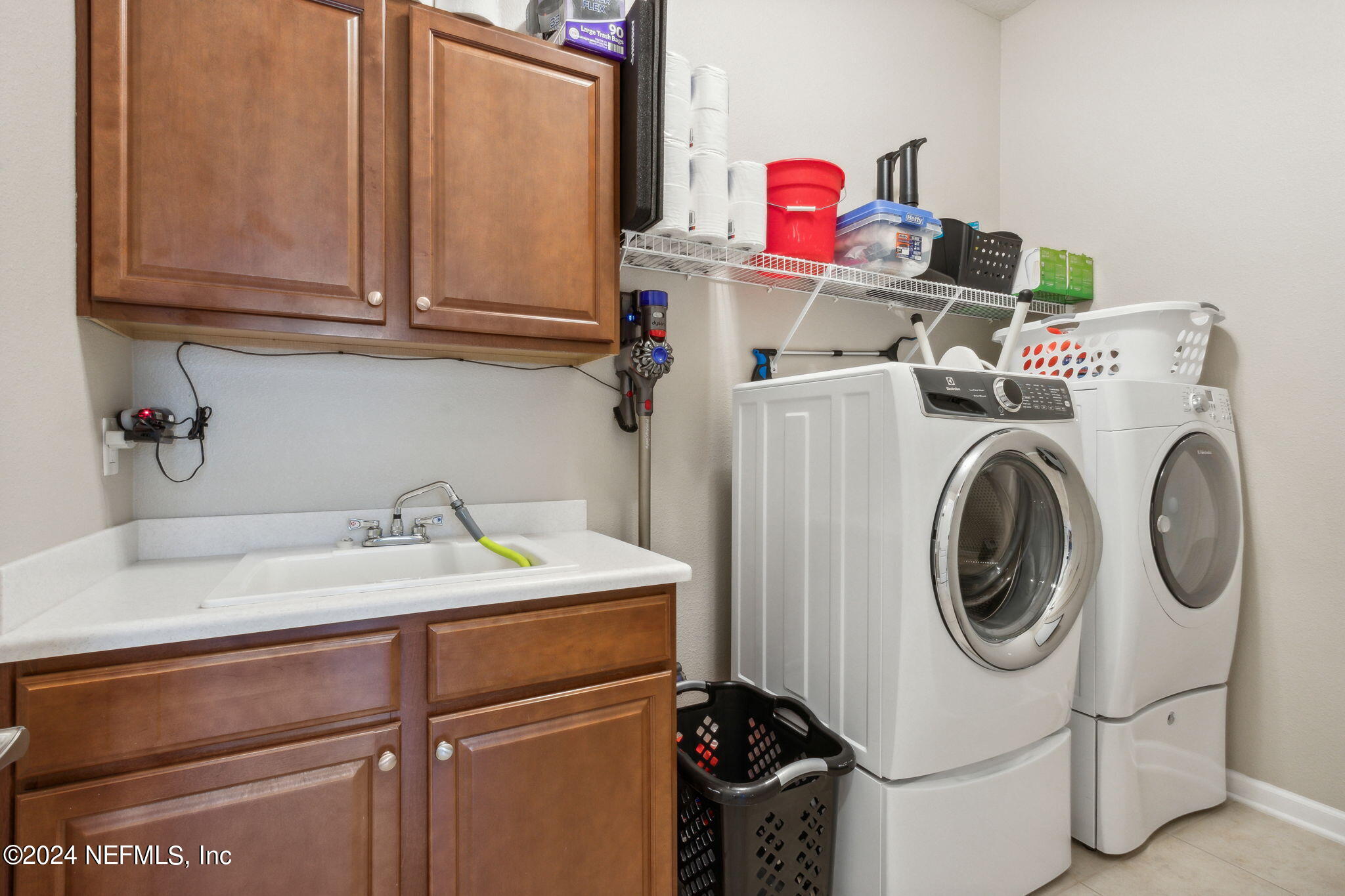 369 Medio Drive St. Augustine, FL 32095 - Photo 21 of 25 a utility room with dryer and washer