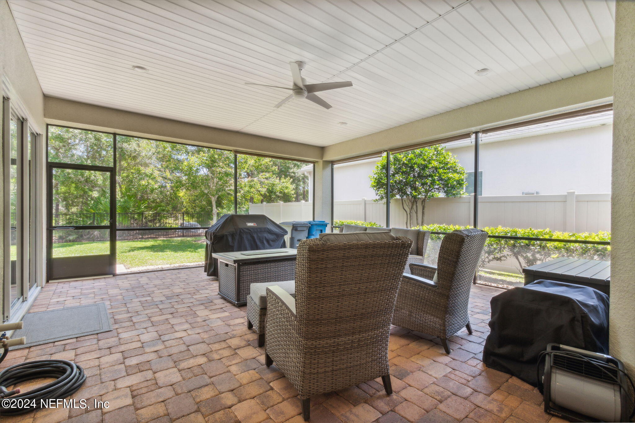 369 Medio Drive St. Augustine, FL 32095 - Photo 22 of 25 a living room with furniture and a floor to ceiling window