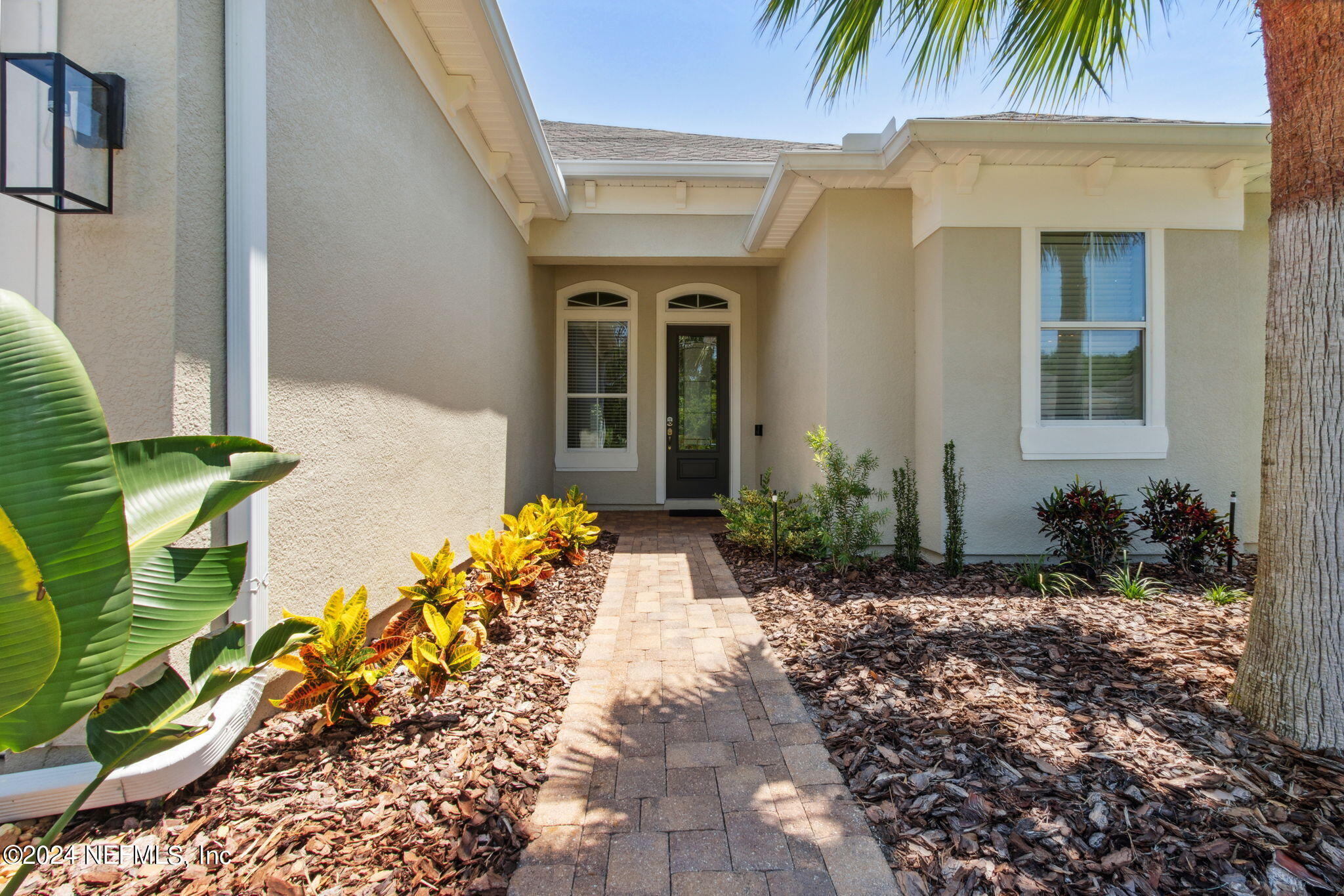 369 Medio Drive St. Augustine, FL 32095 - Photo 3 of 25 a front view of a house with a yard