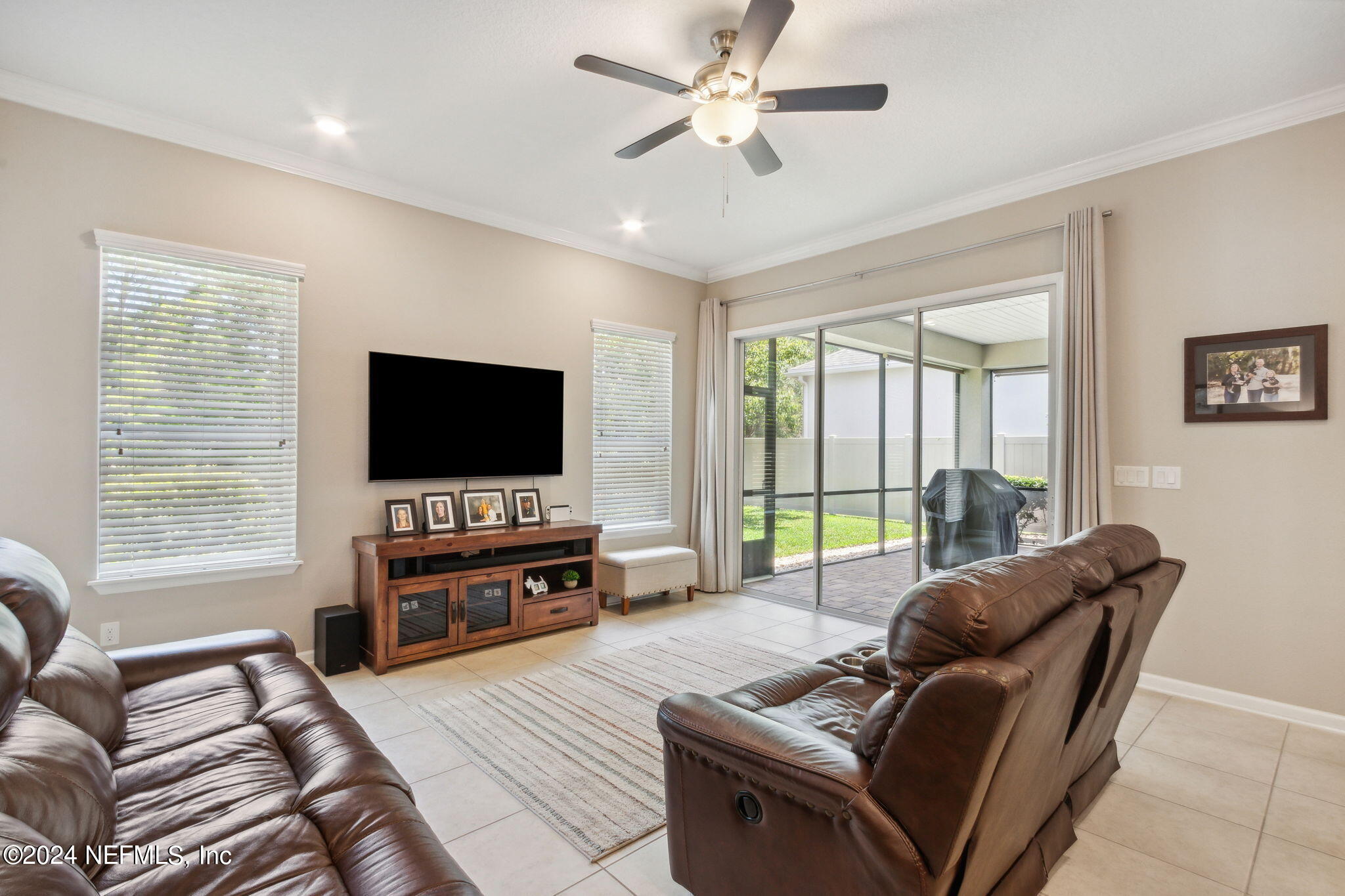 369 Medio Drive St. Augustine, FL 32095 - Photo 10 of 25 a living room with furniture and a flat screen tv