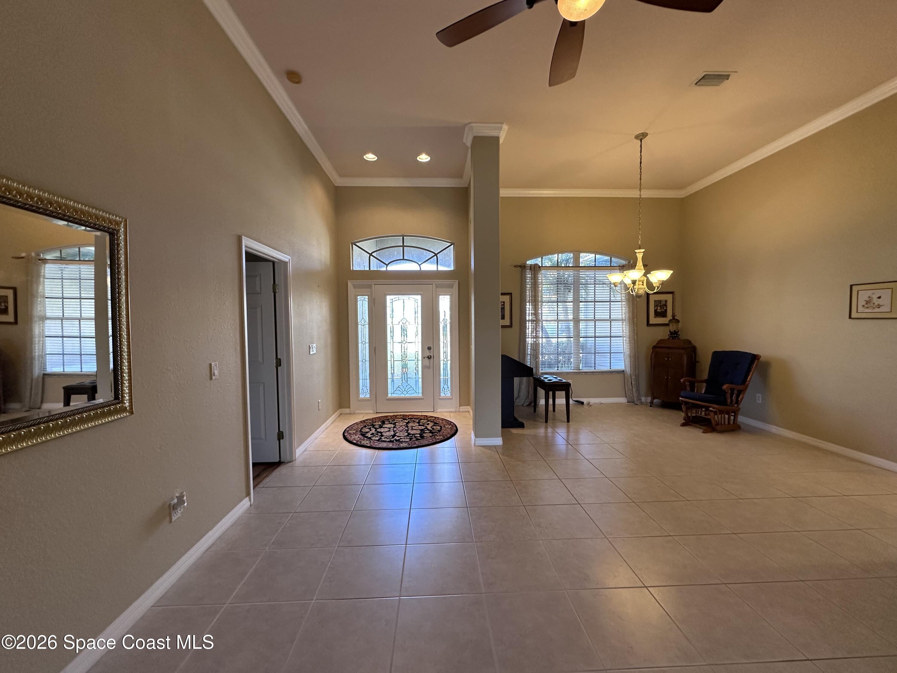 883 Spring Oak Drive Melbourne, FL 32901 - Photo 7 of 45 a view of a livingroom with furniture and a window