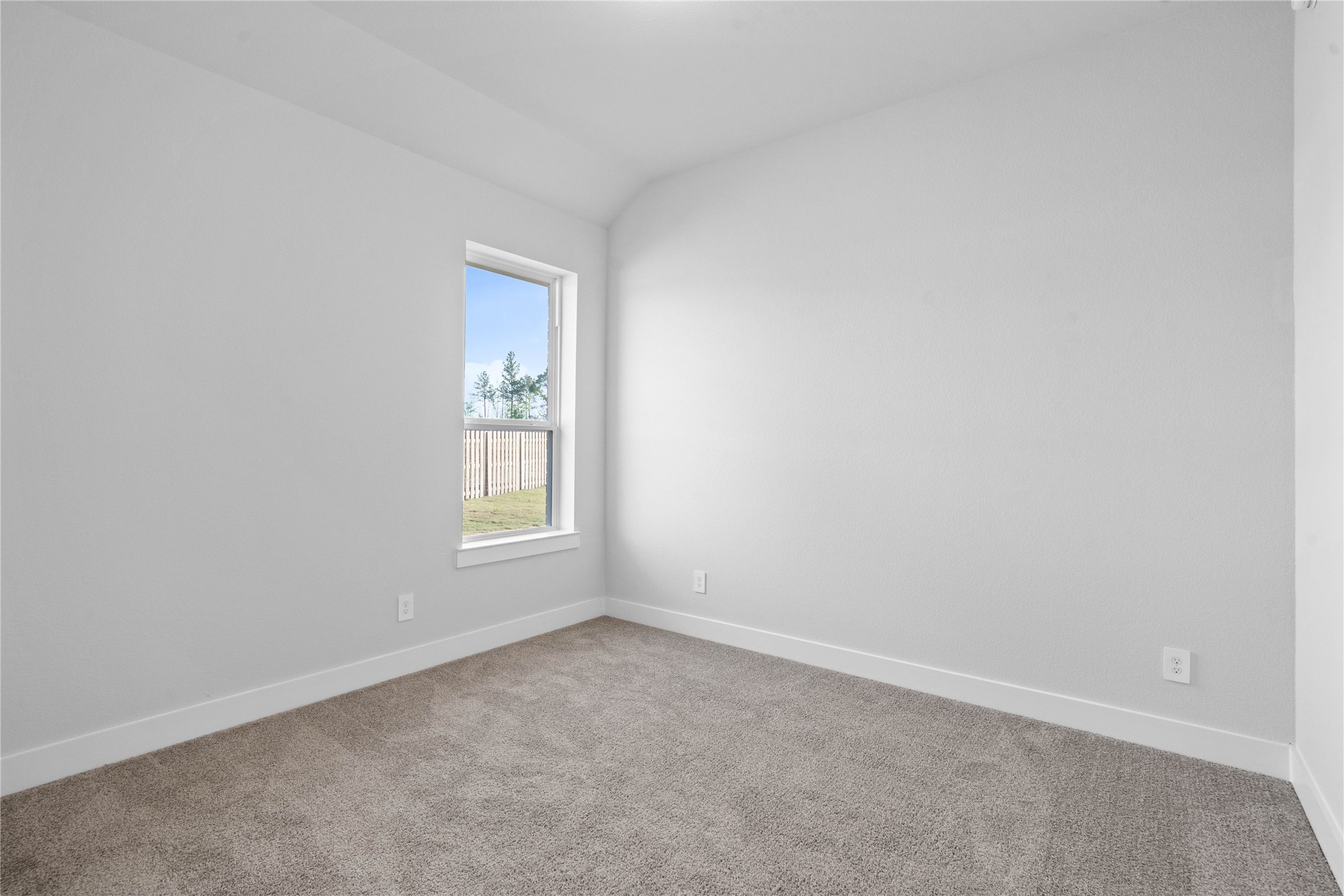 2114 Rowl Street Montgomery, TX 77316 - Photo 10 of 50 This bright secondary bedroom offers a versatile and neutral space, ideal for a guest room, home office, or quiet retreat. It features plush carpeting, large window, stoped ceilings, custom paint, and a walk-in closet.