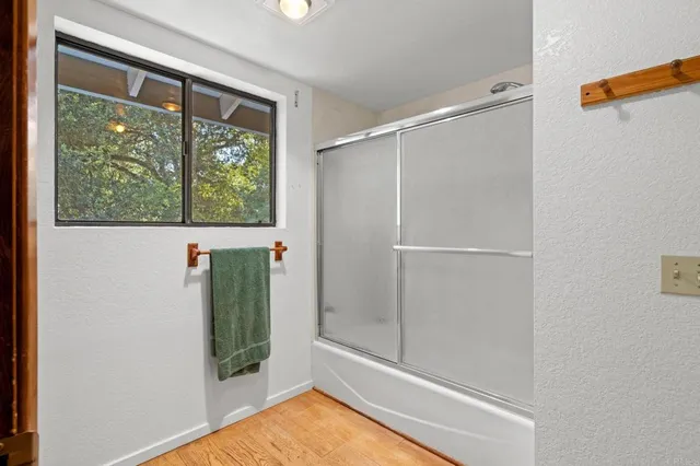 a bathroom with a bathtub and a shower
