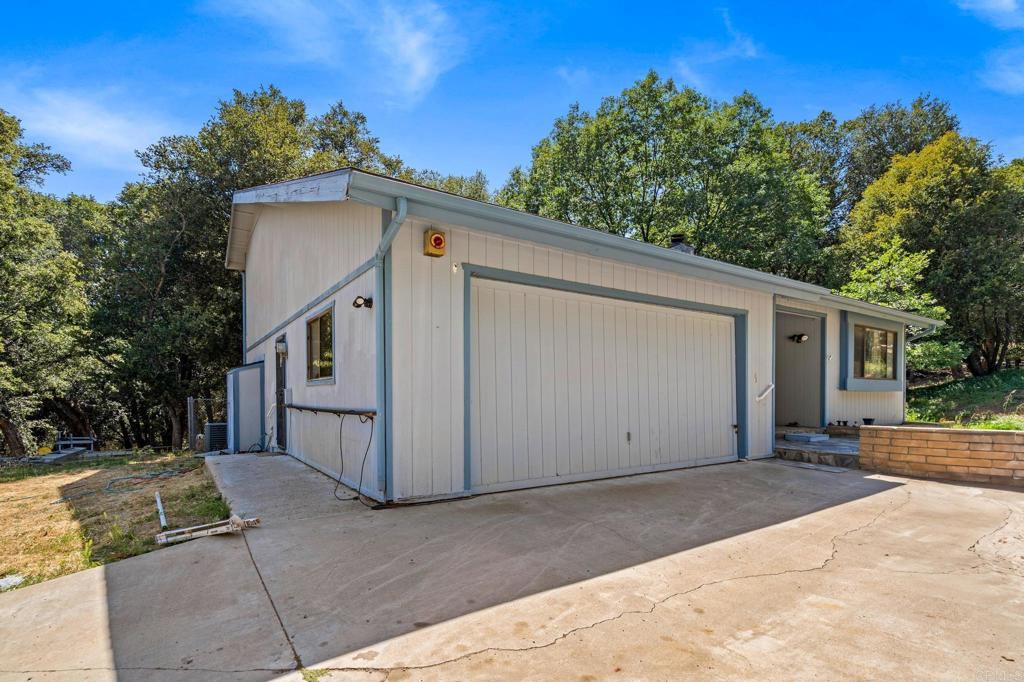 5041 Pine Ridge Avenue Julian, CA 92036 - Photo 2 of 27 a view of a house with a backyard