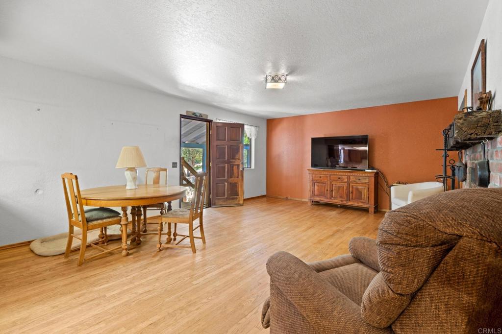 5041 Pine Ridge Avenue Julian, CA 92036 - Photo 9 of 27 a living room with furniture and a wooden floor