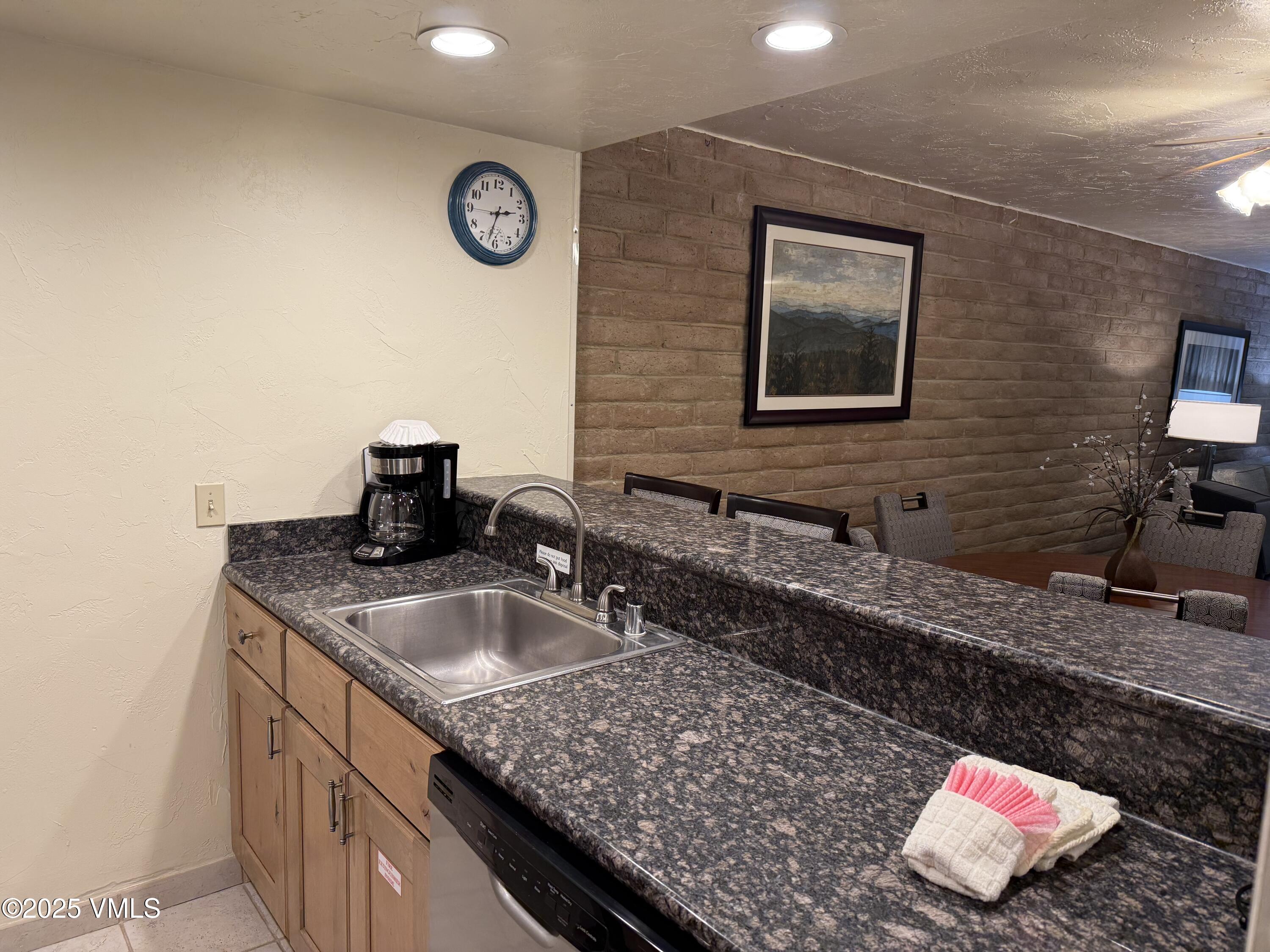 1020 Vail View Drive, Unit 321215 Vail, CO 81657 - Photo 10 of 23 a bathroom with sink and mirror