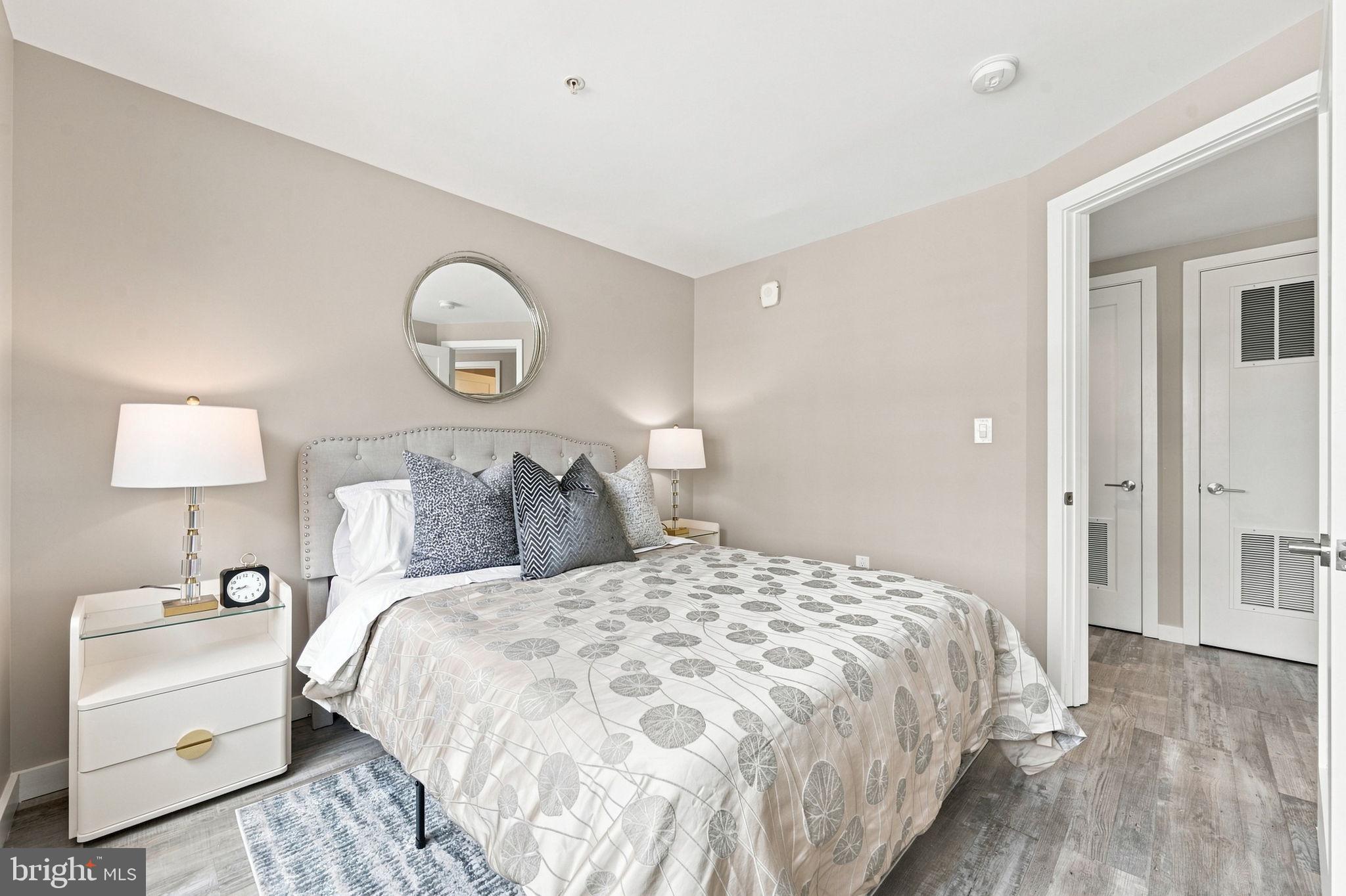 700 Roeder Road, Unit 203 Silver Spring, MD 20910 - Photo 16 of 37 Serene bedroom with modern elegance.
