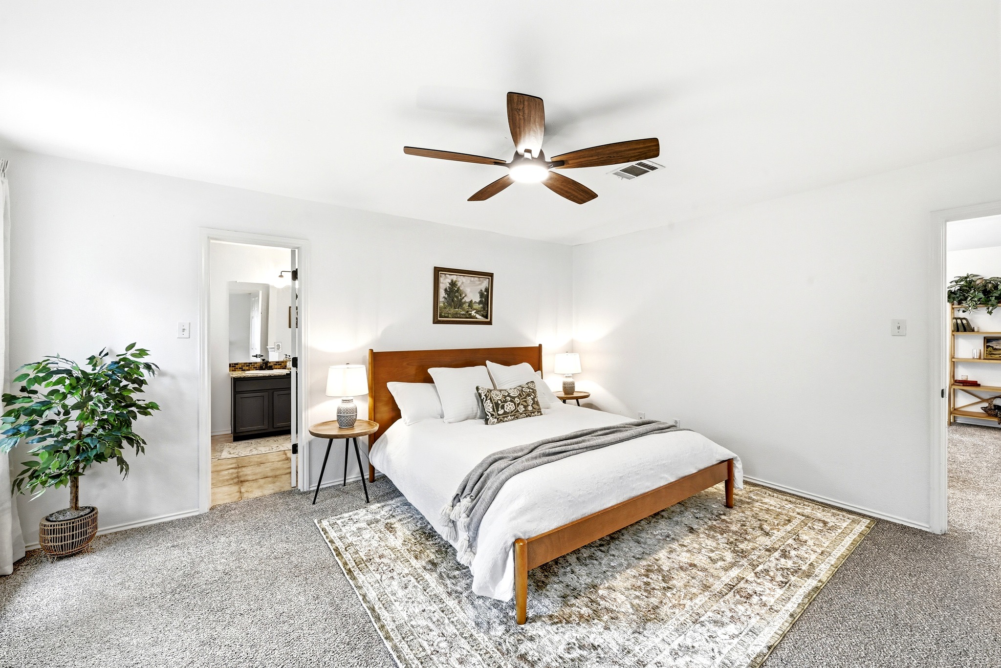 1801 Monks Tale Court Austin, TX 78748 - Photo 17 of 36 Unwind in this peaceful primary bedroom featuring a ceiling fan and convenient access to a private bathroom.