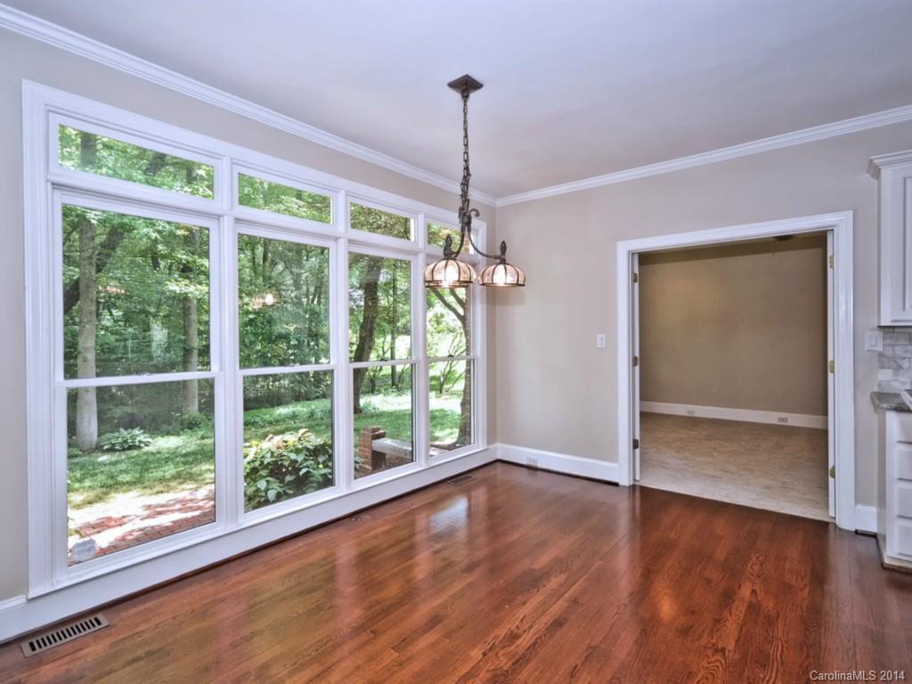 13504 Scanlan Way Davidson, NC 28036 - Photo 11 of 23 a view of empty room with wooden floor and fan